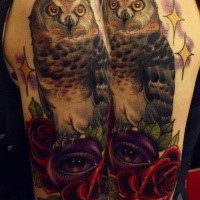 Illustrative style colored shoulder tattoo of big owl with stars