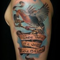 Illustrative style colored shoulder tattoo of beautiful bird with lettering