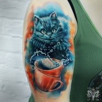 Illustrative style colored shoulder tattoo of Cheshire cat with cup