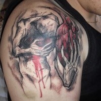Illustrative style colored shoulder tattoo of creepy monster with human heart