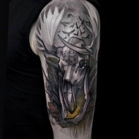 Illustrative style colored shoulder tattoo of interesting looking animal skull with birds