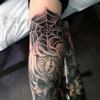 Illustrative style colored sleeve tattoo of spider web and clock