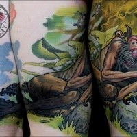 Illustrative style colored thigh tattoo of sleeping man with frog