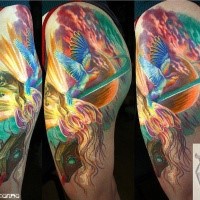 Illustrative style colored thigh tattoo of flying fantasy bird and planet