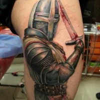 Illustrative style colored thigh tattoo of bloody medieval knight