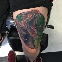 Illustrative style colored thigh tattoo of dinosaur with leaves