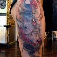 Illustrative style colored thigh tattoo of saint bull with snake