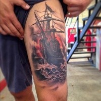 Illustrative style colored thigh tattoo of gorgeous sailing ship