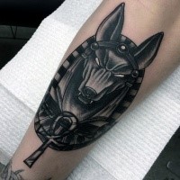 Illustrative style detailed arm tattoo of creepy Egypt God Anubis