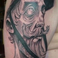 Illustrative style detailed shoulder tattoo of man with beard face