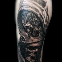 Illustrative style very detailed shoulder tattoo of man in gas mask and human skeleton