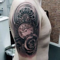 Impressive black and white antic clock shoulder tattoo with flowers