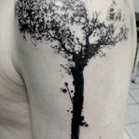 Impressive black ink tree shaped upper arm tattoo