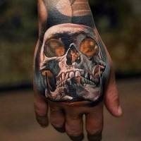 Impressive design colored skull tattoo on hand in 3D style