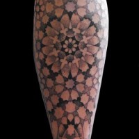 Impressive designed and painted big floral ornament tattoo on leg