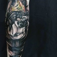 Impressive designed colored cad bear with apple tattoo on arm