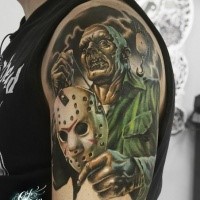 Impressive illustrative style colored shoulder tattoo of Jason maniac with mask and hook