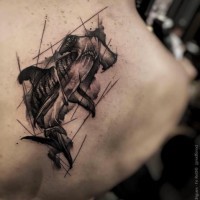 Impressive looking black ink sampled tattoo on back of hammerhead shark