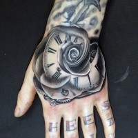 IMpressive painted black and white flower shaped mechanic clock tattoo on hand
