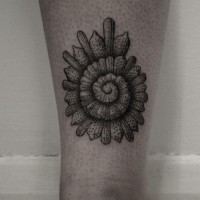 Impressive shell shaped tattoo on ankle