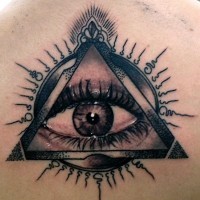 Impressive very detailed mystical eye in pyramid tattoo on back