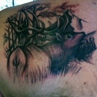 Incredible black and white shoulder tattoo of detailed deer in forest