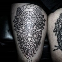Incredible black and white thigh tattoo of ornamental fox with flowers