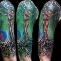 Incredible designed and colored large shoulder tattoo of human shaped fantasy tree