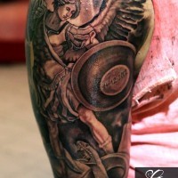 Incredible designed colored memorial arm tattoo with angel fighting the snake