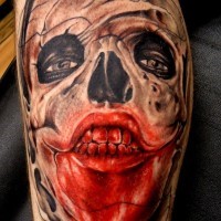 Incredible looking colored arm tattoo of bloody skull