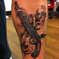 Incredible looking colored forearm tattoo of antic pistol