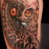 Incredible looking colored thigh tattoo of fantasy skull with creepy eye