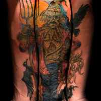 Incredible looking multicolored forearm tattoo of scarecrow with black crows