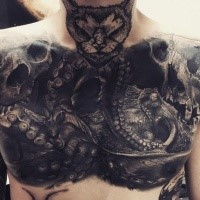 Incredible looking very detailed chest tattoo of big octopus with cat head and skull