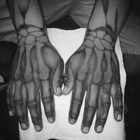 Incredible looking white ink style hands tattoo of realistic human bones
