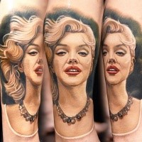 Incredible Marlin Monroe with waving hair lifelike 3D realistic portrait colored tattoo in realism style