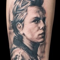 Incredible real photo like black and whited forearm tattoo of mans portrait