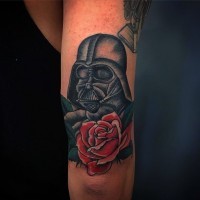 Incredible very detailed old school colored Darth Vader Mask tattoo on arm stylized with flower