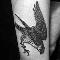Indian traditional style black ink thigh tattoo of flying eagle