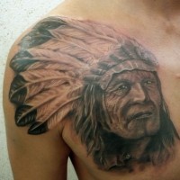 Indian with feathers on his head shoulder and chest tattoo