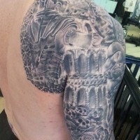Interesting black ink detailed looking shoulder and sleeve tattoo of ancient warrior in dark dungeon