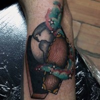 Interesting colored little coffin with planet and stars tattoo on arm