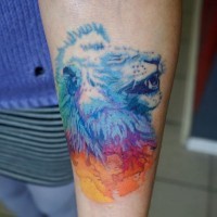 Interesting colored tiny forearm tattoo of lion head