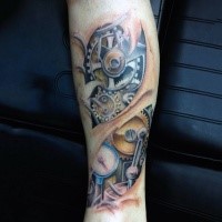 Interesting colored under skin mechanism tattoo on forearm