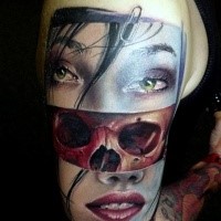 Interesting combined and colored shoulder tattoo of woman face with skull