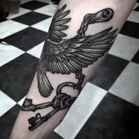 Interesting combined black ink eagle with keys tattoo on arm