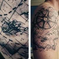 Interesting combined black ink world map shoulder tattoo with compass