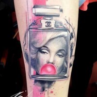 Interesting combined colored perfume bottle tattoo on forearm with Merlin Monroe portrait