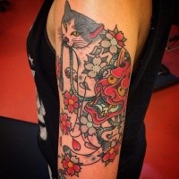 Interesting looking and colored shoulder tattoo by horitomo