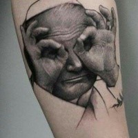 Interesting looking arm tattoo of funny Pope